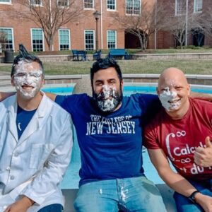 Three math faculty getting pied for pi day
