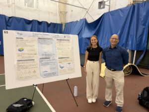 Dr. Mizuhara with student researcher Meghan Ryan at her poster on population dynamics on fractals